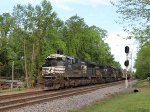 NS 1091 leads train 62U past the signals at "waffle House" early in the morning